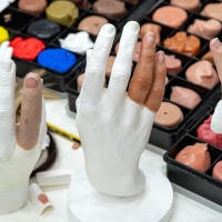 Finger prostheses on two plaster hand models.